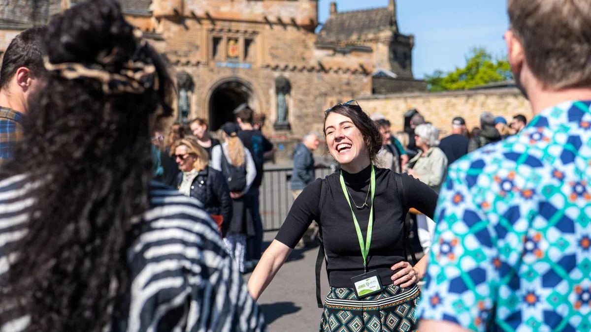 Group listening to a guide beside the Argyle Battery on an Edinburgh Castle guided history tour