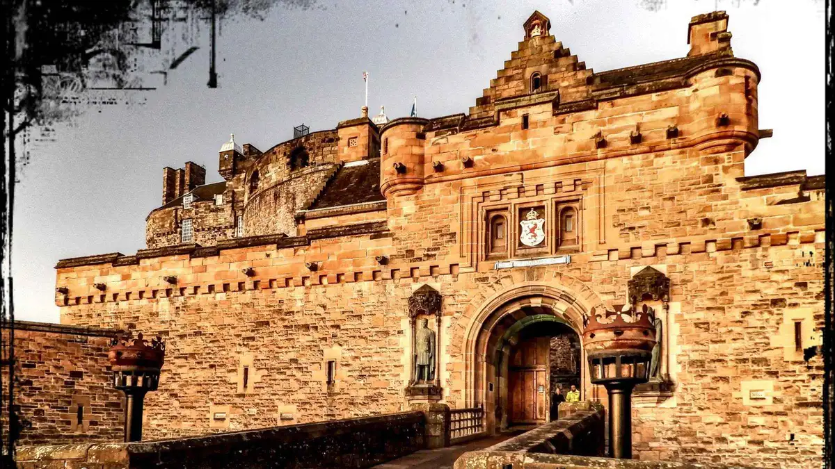 Visitors gathered by the castle gatehouse on a guided Edinburgh Castle tour with tickets included
