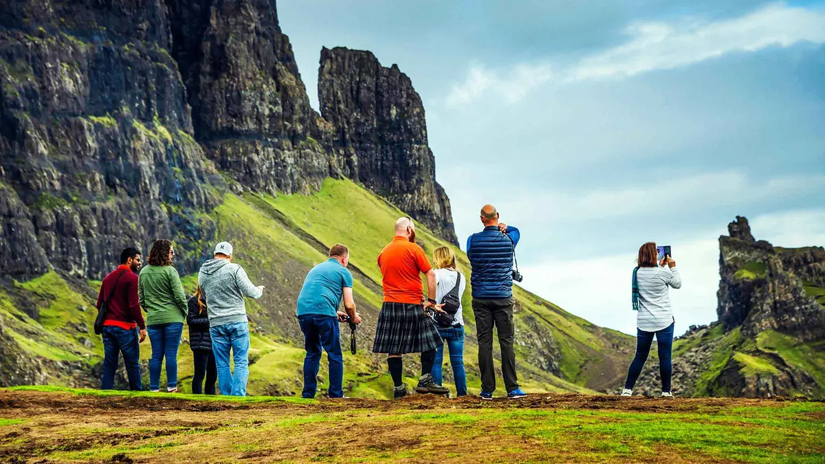 Tour minibus group at the Old Man of Storr on the Isle of Skye during a 3-day Highlands trip from Edinburgh