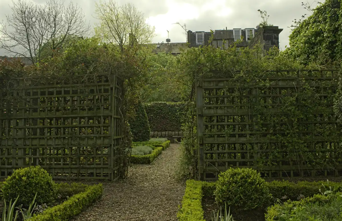 Dunbar's Close garden off the Royal Mile, clipped hedges and benches in an enclosed courtyard behind the tenements